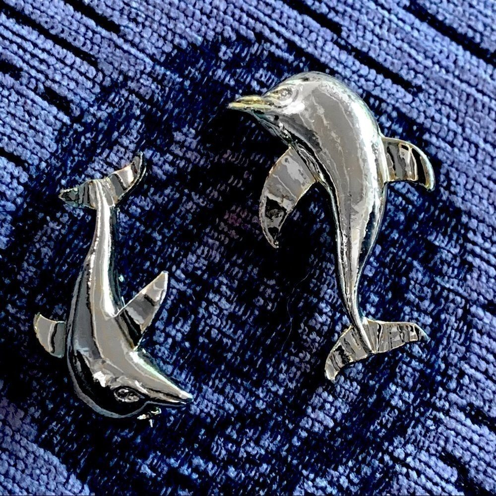 Pair of silver frolicking dolphin pins by Gerry